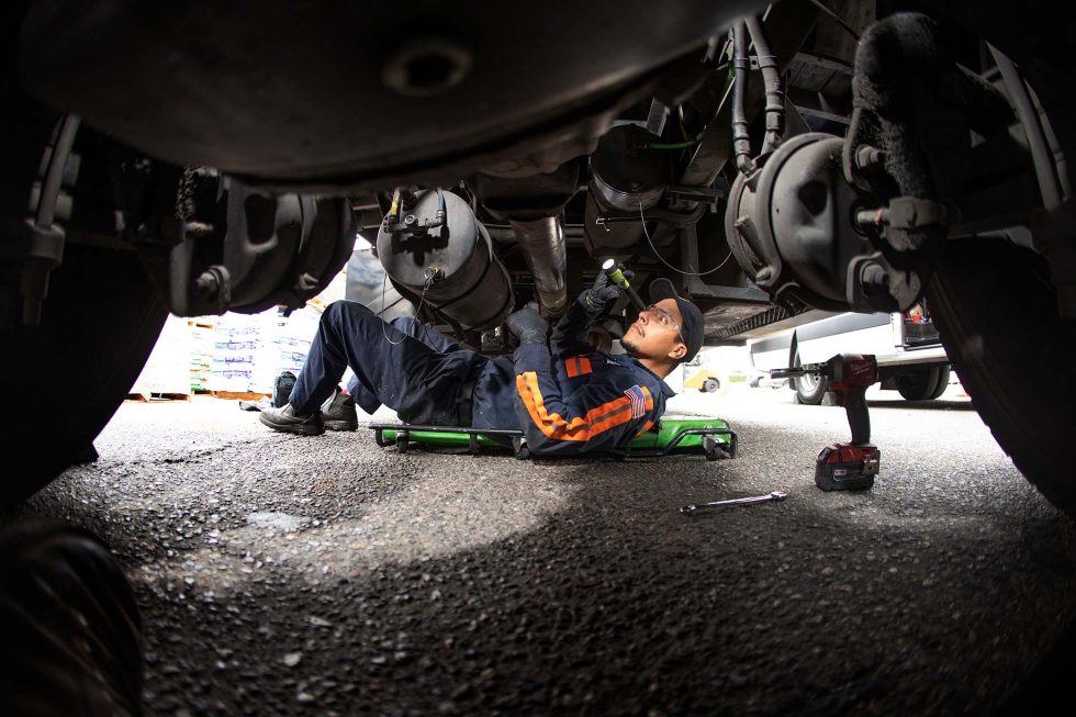 Mechanic working on semi truck